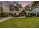 Charming home featuring a well-manicured lawn and a welcoming front porch with rocking chairs at 3013 Surrey Ln, Atlanta, GA 30341
