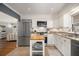 Bright kitchen with white cabinets, stainless steel appliances, and a butcher block island at 3013 Surrey Ln, Atlanta, GA 30341