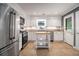 Well-lit kitchen featuring stainless steel appliances and ample counter space at 3013 Surrey Ln, Atlanta, GA 30341