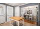 Bright kitchen with center island, pantry, and open view to the dining area at 3013 Surrey Ln, Atlanta, GA 30341
