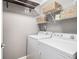 Functional laundry room with shelving and modern washer and dryer units at 3013 Surrey Ln, Atlanta, GA 30341
