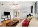 Spacious living room with a TV, comfortable seating, and access to a balcony at 3013 Surrey Ln, Atlanta, GA 30341