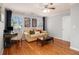 Comfortable living room with hardwood floors and plenty of natural light at 3013 Surrey Ln, Atlanta, GA 30341