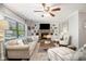 Cozy living room with fireplace, built-in shelving, and plush seating at 3013 Surrey Ln, Atlanta, GA 30341
