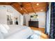 Comfortable main bedroom featuring hardwood floors, and a bathroom view at 3013 Surrey Ln, Atlanta, GA 30341