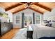 Serene main bedroom with wood ceiling, hardwood floors, and access to an outdoor deck at 3013 Surrey Ln, Atlanta, GA 30341