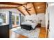 Serene main bedroom with vaulted wood ceilings, a ceiling fan, and access to a private balcony at 3013 Surrey Ln, Atlanta, GA 30341
