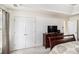 View of the main bedroom featuring double closets and a door to the ensuite bathroom at 4207 Fortune Pt, South Fulton, GA 30349