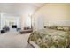 This large bedroom features carpet, an attached seating area, and two doors at 4207 Fortune Pt, South Fulton, GA 30349