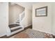Staircase with dark wood steps and white risers complemented by a decorative rug at 4207 Fortune Pt, South Fulton, GA 30349