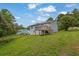 Back exterior featuring a raised deck overlooking the lawn at 4665 Big Valley Rd, Stone Mountain, GA 30083