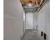 Unfinished basement featuring exposed ceiling and unfinished concrete flooring at 4665 Big Valley Rd, Stone Mountain, GA 30083