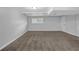 Unfinished basement showcasing neutral walls, plush carpeting, and a window allowing natural light at 4665 Big Valley Rd, Stone Mountain, GA 30083