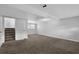 Finished basement with carpet, window, and access to the stairwell at 4665 Big Valley Rd, Stone Mountain, GA 30083