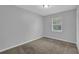 Bedroom featuring carpet, a window, and neutral colored walls at 4665 Big Valley Rd, Stone Mountain, GA 30083