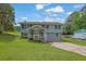 Charming two-story home features a welcoming front porch and a well-maintained lawn at 4665 Big Valley Rd, Stone Mountain, GA 30083