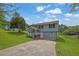 A charming two-story home with a well-maintained lawn and long driveway at 4665 Big Valley Rd, Stone Mountain, GA 30083