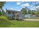 Charming two-story home boasts well-manicured lawn and a detached garage at 4665 Big Valley Rd, Stone Mountain, GA 30083