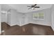 Bright living room featuring dark hardwood flooring and a large window at 4665 Big Valley Rd, Stone Mountain, GA 30083