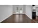 Open living room featuring wood floors and French doors with view into the back yard at 4665 Big Valley Rd, Stone Mountain, GA 30083