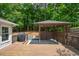 Backyard features a wood deck, outdoor grill, and a gazebo at 615 Woodwork Way, Roswell, GA 30076