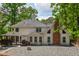 Spacious home backyard featuring a stone ground, brick chimney and a covered gazebo with wood deck at 615 Woodwork Way, Roswell, GA 30076