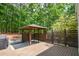 Backyard features a wood deck, outdoor grill, and a gazebo at 615 Woodwork Way, Roswell, GA 30076