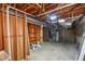 The basement offers unfinished walls, plumbing, lighting, and concrete floor at 615 Woodwork Way, Roswell, GA 30076