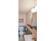 Small powder room in a vintage style featuring wallpaper, a toilet, and a sink with vanity at 615 Woodwork Way, Roswell, GA 30076