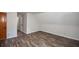 Bright bedroom with hardwood floors, white walls, and a spacious closet at 615 Woodwork Way, Roswell, GA 30076