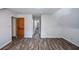 Bright bedroom with hardwood floors, white walls, and a spacious closet at 615 Woodwork Way, Roswell, GA 30076