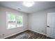 Bedroom featuring new floors, natural light from the windows and a ceiling light at 615 Woodwork Way, Roswell, GA 30076
