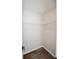 Walk-in closet featuring white wire shelving and laminate flooring at 615 Woodwork Way, Roswell, GA 30076