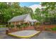 Community clubhouse with brick stairs, surrounded by beautiful landscaping and mature trees at 615 Woodwork Way, Roswell, GA 30076