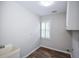 Laundry room with a window, utility sink, and a washer and dryer hookup at 615 Woodwork Way, Roswell, GA 30076