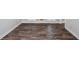 Hardwood-style flooring in a spacious and brightly-lit room at 615 Woodwork Way, Roswell, GA 30076