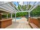 Community pool area, with an outdoor cooking area and a glimpse of the swimming pool at 615 Woodwork Way, Roswell, GA 30076