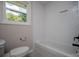 A bathroom featuring subway tile and modern, matte-black hardware at 6213 Cherry Ln, Douglasville, GA 30134