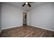 A beautifully finished bedroom featuring hard wood floors and a ceiling fan for comfort at 6213 Cherry Ln, Douglasville, GA 30134