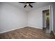 A beautifully finished bedroom with a ceiling fan and ensuite bathroom access at 6213 Cherry Ln, Douglasville, GA 30134