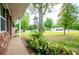 View of the front porch and landscaped yard of this lovely home at 6213 Cherry Ln, Douglasville, GA 30134