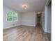 Bright living room features wood-look flooring and fresh paint at 6213 Cherry Ln, Douglasville, GA 30134
