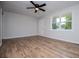 Light filled living room with hard surface floors and a ceiling fan at 6213 Cherry Ln, Douglasville, GA 30134