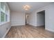 Bright living room with wood-look floors and neutral color palette at 6213 Cherry Ln, Douglasville, GA 30134