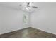 This bedroom has hardwood floors, a ceiling fan and a window for plenty of natural light at 4353 Pond Edge Rd, Snellville, GA 30039