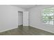 This bright bedroom features a window for natural light and a closet for ample storage at 4353 Pond Edge Rd, Snellville, GA 30039