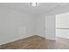 Bedroom with hardwood floors and neutral walls, offering a bright, adaptable living space at 4353 Pond Edge Rd, Snellville, GA 30039