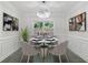 Elegant dining room with modern chandelier, wainscoting, and stylish decor at 4353 Pond Edge Rd, Snellville, GA 30039