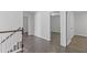 Hallway featuring hardwood floors and neutral paint at 4353 Pond Edge Rd, Snellville, GA 30039