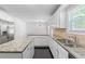 Bright kitchen featuring granite countertops, stainless steel appliances, and ample cabinet space at 4353 Pond Edge Rd, Snellville, GA 30039